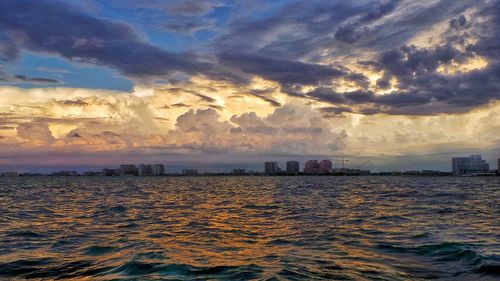 View of calm sea against cloudy sky