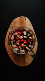 High angle view of chopped fruits in bowl on table