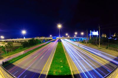 High angle view of light trails on road at night