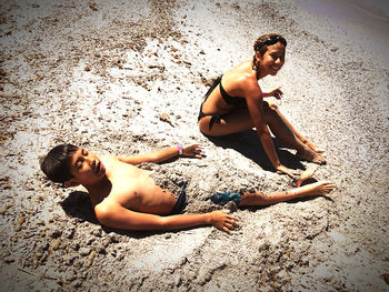Young couple on sand at beach