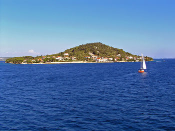 Scenic view of sea against clear blue sky