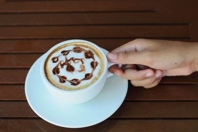 High angle view of coffee cup on table