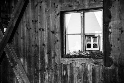 Abandoned building seen through window