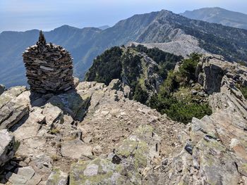 Rock formation on mountain against sky