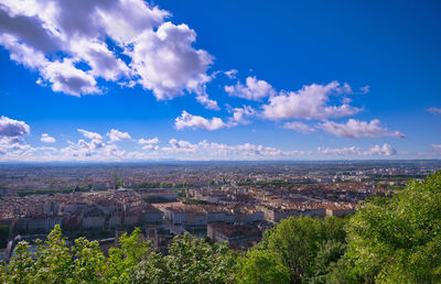 Aerial view of townscape against sky