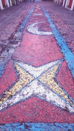 High angle view of multi colored road marking on footpath