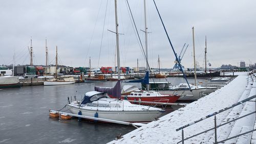 Boats moored at harbor