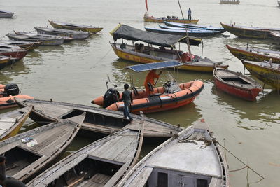 High angle view of sailboats moored in river