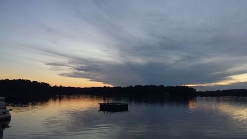 Scenic view of lake at sunset