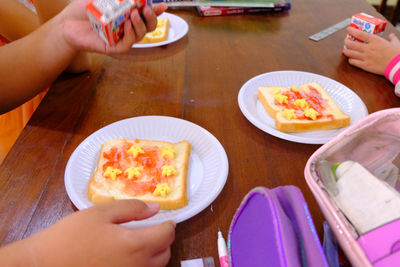 High angle view of people holding food