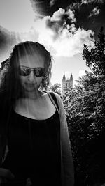 Woman wearing sunglasses against sky