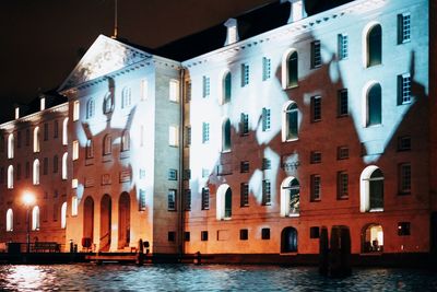 Buildings in city at night