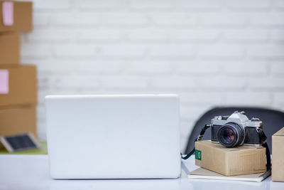 Close-up of camera on table