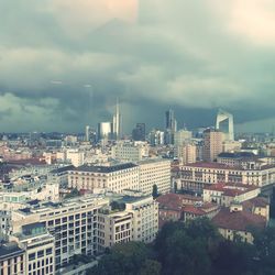 High angle view of buildings in city against sky