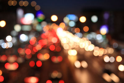 Defocused image of illuminated lights at night