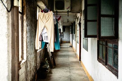 Clothes drying on alley amidst buildings