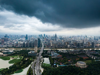 High angle view of modern buildings in city against sky