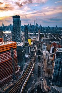 High angle view of buildings in city during sunset