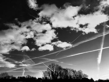 Low angle view of vapor trails in sky