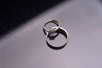 High angle view of wedding rings on metal