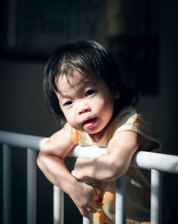 Portrait of cute baby girl at home