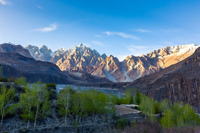 Scenic view of landscape and mountains against sky