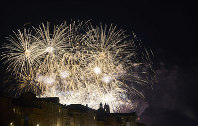 Firework display at night