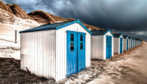 Beach huts against sky