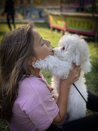 Side view of woman with dog