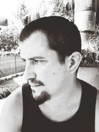 Close-up portrait of young man looking away