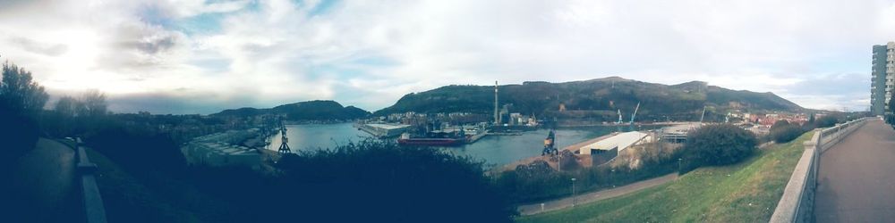 Panoramic shot of river against cloudy sky