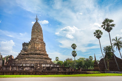 View of temple building against cloudy sky