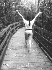 Full length of woman walking on footpath