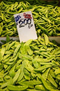 Close-up of green peas for sale at market stall