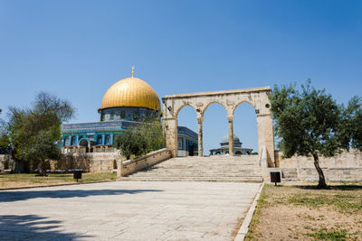 View of historical building against clear blue sky