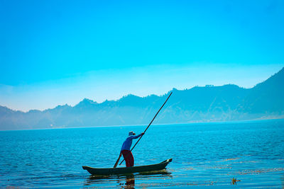 Man standing on fishing boat 