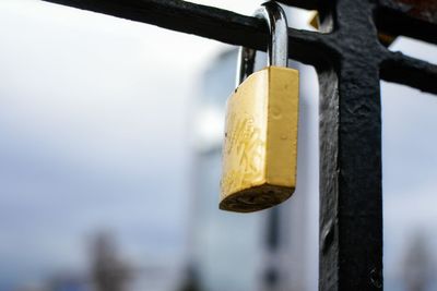 Close-up of padlock on railing