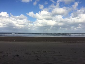 Scenic view of beach against sky