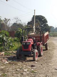 Tractor on field against sky