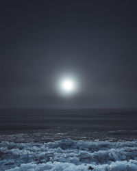 Scenic view of snow against sky at night