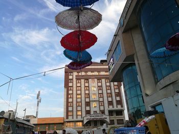 Low angle view of buildings in city against sky