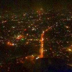 View of illuminated road at night