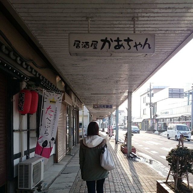 architecture, built structure, text, building exterior, rear view, men, person, lifestyles, western script, walking, full length, building, communication, non-western script, city, graffiti, architectural column, ceiling