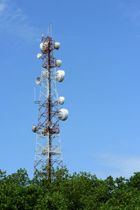 Low angle view of communications tower against sky