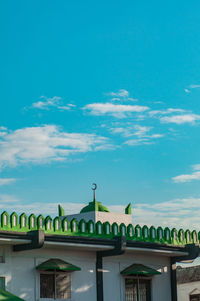 Low angle view of building against blue sky