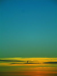 Scenic view of sea against clear sky during sunset