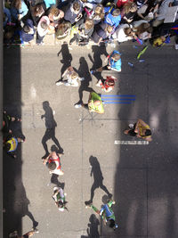 High angle view of people walking on street