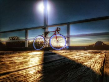 Surface level of bicycle parked against blue wall