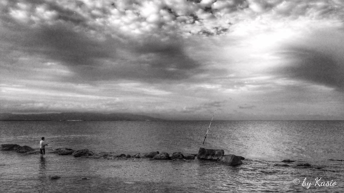 sea, water, horizon over water, sky, cloud - sky, nautical vessel, cloudy, tranquility, scenics, tranquil scene, beauty in nature, cloud, boat, nature, transportation, beach, overcast, mode of transport, idyllic, weather