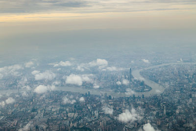 Aerial view of cityscape against sky during sunset